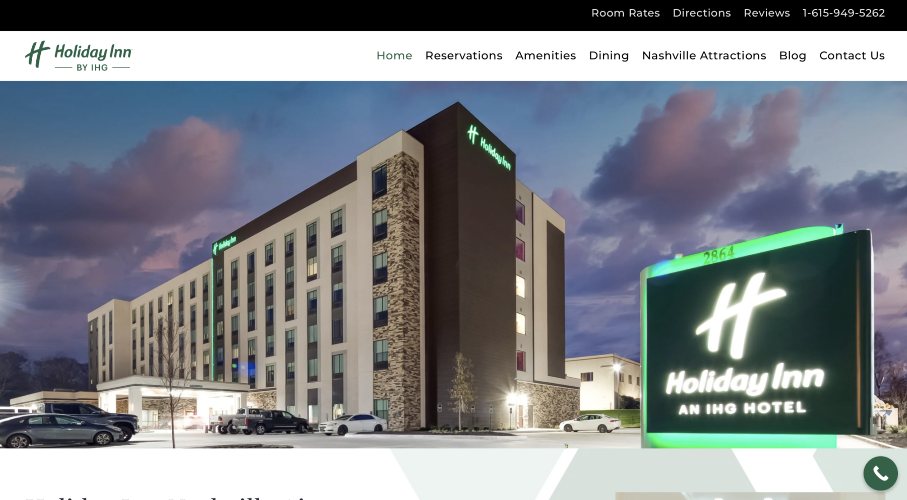 Exterior view of Holiday Inn Nashville Airport hotel at dusk with welcoming entrance and modern design near BNA airport.