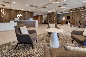 Modern hotel lobby at Holiday Inn Nashville Airport with comfortable seating and stylish design near BNA Airport.