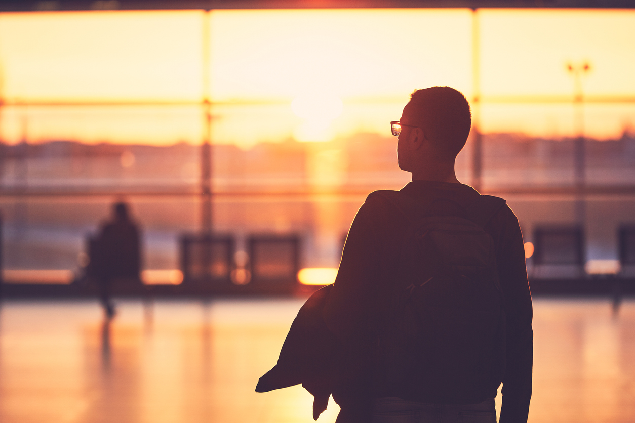 Traveler at airport early morning flight