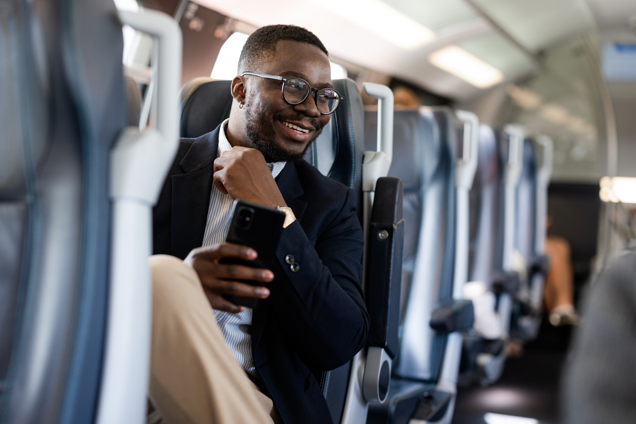 Business traveler flying on plane for a work trip