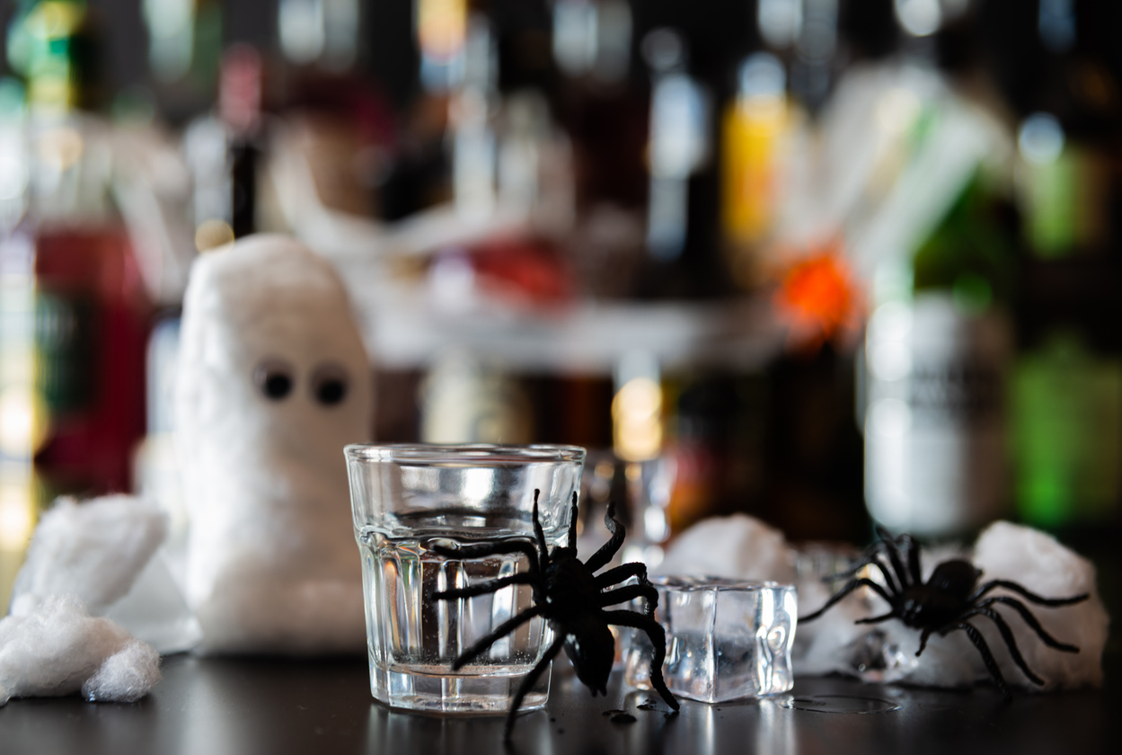 Halloween-themed cocktail on the bar surrounded by spooky decorations at Rooh Bar inside Holiday Inn Nashville Airport.